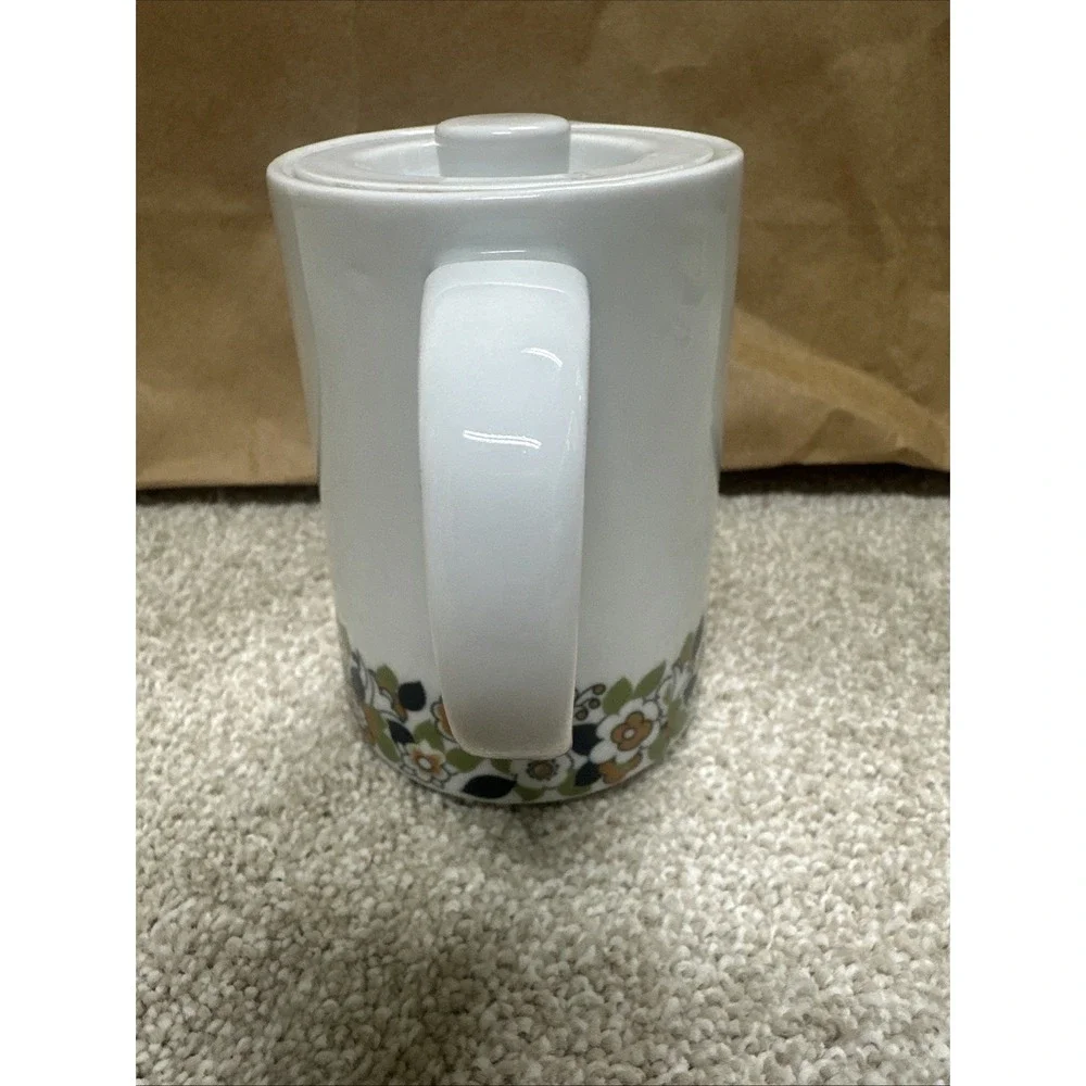 Vintage cream pitcher in the retro floral, manufactured by Suisse Langenthal